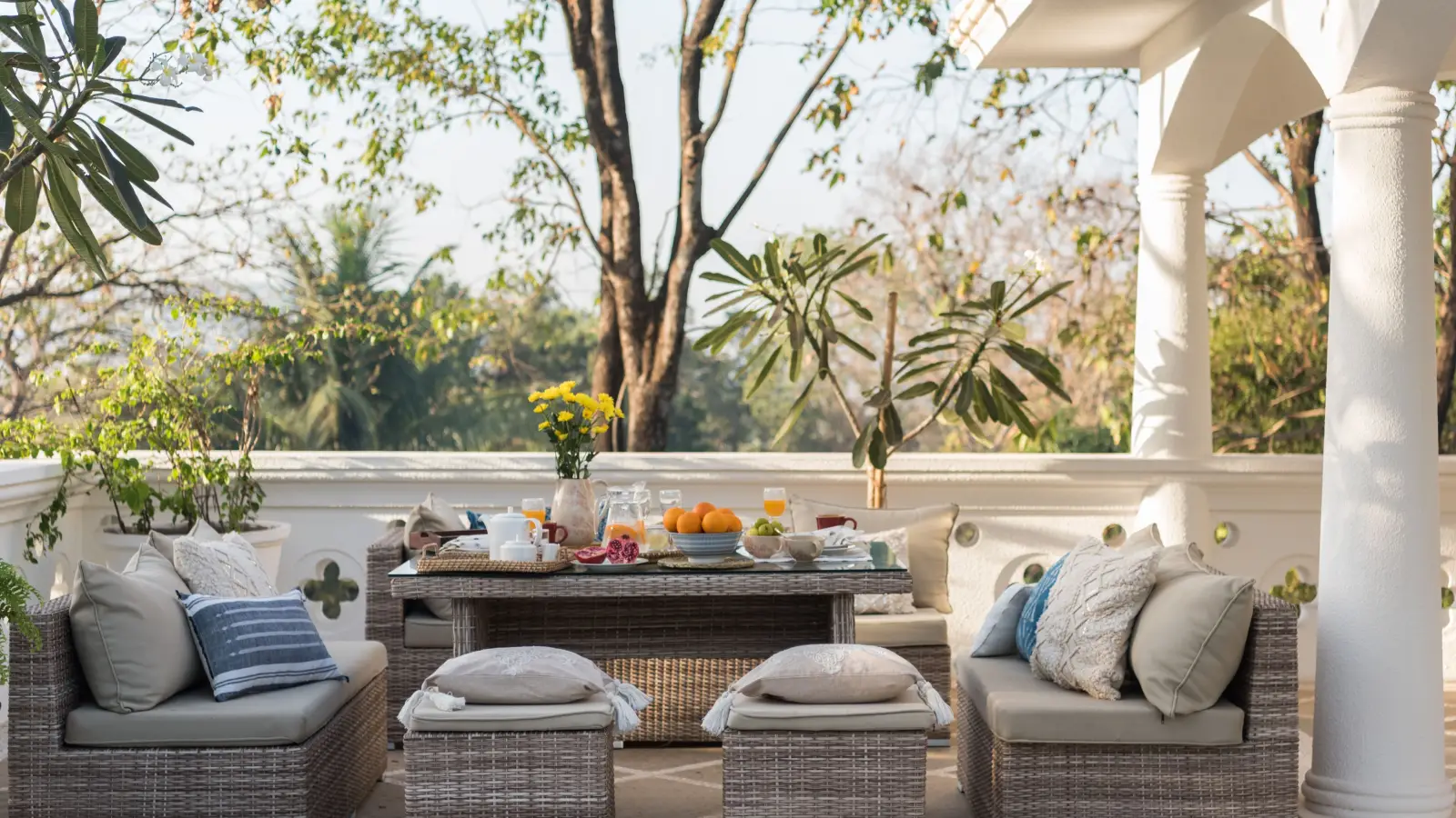 Patio furniture on a Dubai villa patio, ideally under a covered area.